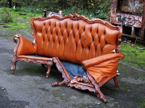 Commercial waste removal van parked in Tottenham street with crew preparing to load items